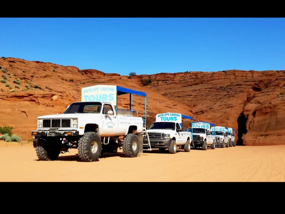 a truck is parked on the side of a mountain